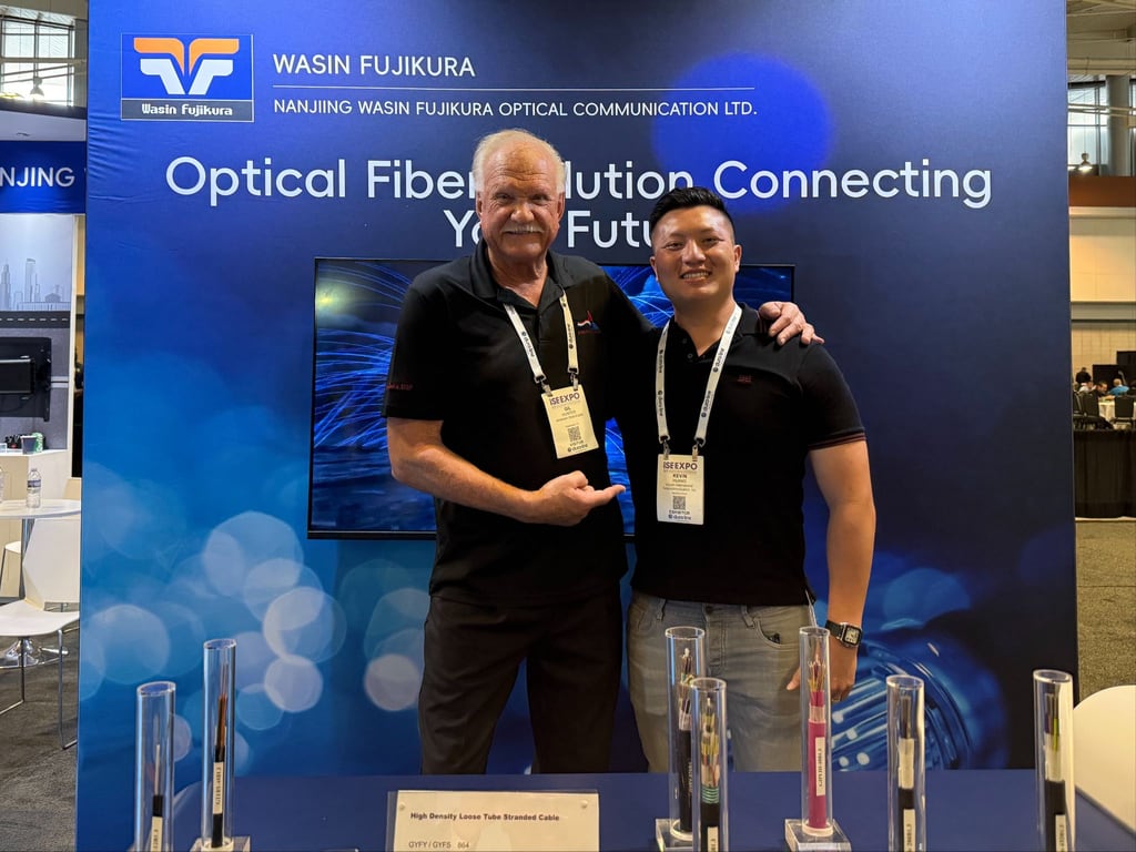 Vocom CEO Kevin Huang with Gil Hunter at the Nanjing Wasin Fujikura fiber optic cable stand, ISE EXPO 2026, Nashville